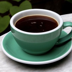 A cup of matcha tea on a table