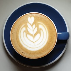 A cup of matcha tea on a table